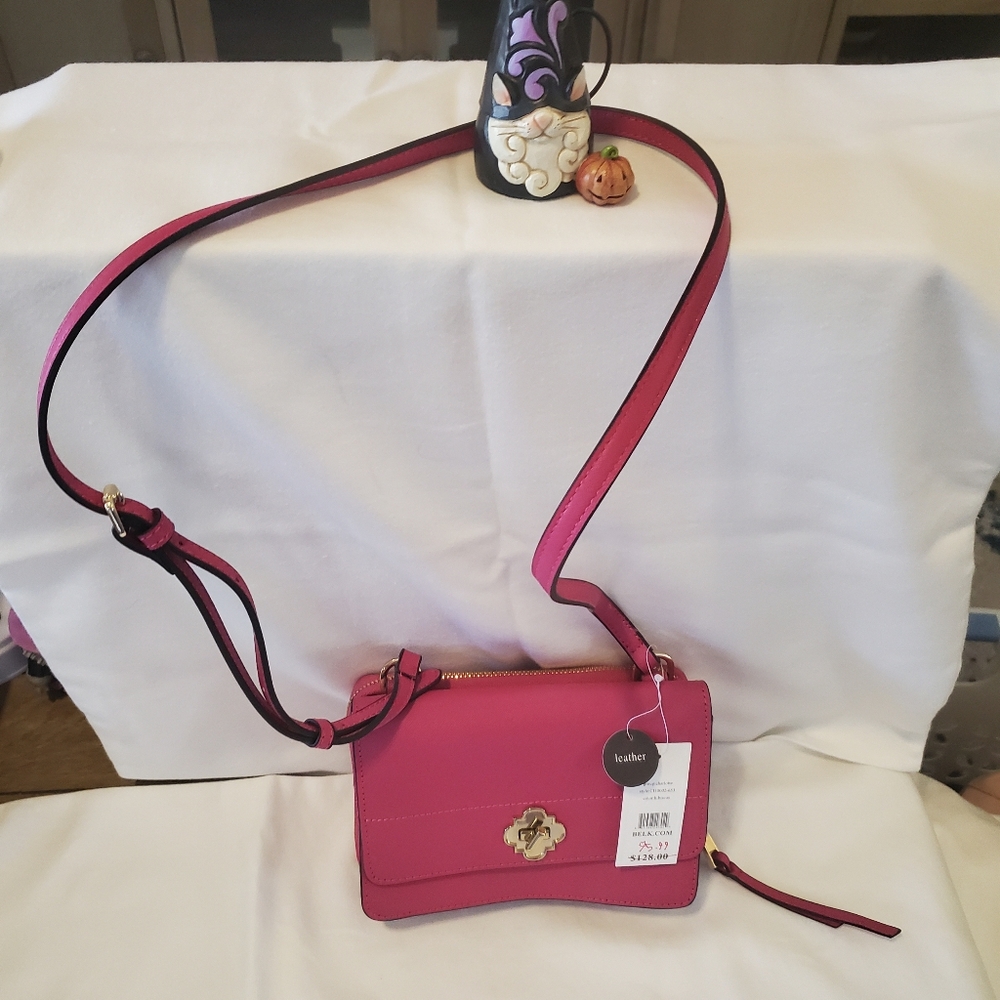 Cute, small but compact  fuschia cross body bag. Crown and Ivy, leather.